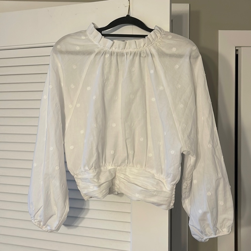 Anthropologie white ruffled blouse